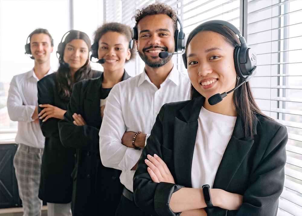 eatOS support specialists wearing headsets, standing together in an office